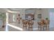 A bar area with counter seating and partial kitchen in the background, offering a welcoming social space at 1900 N Atlantic Ave # 901, Daytona Beach, FL 32118