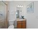 Bright bathroom featuring a glass enclosed shower, vanity, and neutral tones at 1900 N Atlantic Ave # 901, Daytona Beach, FL 32118