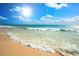 Beautiful beach scene with clear blue water and golden sand, perfect for relaxing and enjoying the sun at 1900 N Atlantic Ave # 901, Daytona Beach, FL 32118