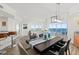 Bright dining area featuring wood floors, modern light fixture, ocean view, and seating for six at 1900 N Atlantic Ave # 901, Daytona Beach, FL 32118