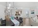 Open-concept dining area showcases the adjacent kitchen and access to the balcony at 1900 N Atlantic Ave # 901, Daytona Beach, FL 32118