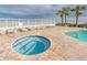 Hot tub by pool with beach access and lounging chairs at 1900 N Atlantic Ave # 901, Daytona Beach, FL 32118
