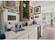 Unique bar area complete with a sink, mini-fridge and charming golf-themed decor at 1924 Seclusion Dr, Port Orange, FL 32128