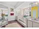 Bright bathroom features a soaking tub, vanity, decorative stained glass window, and stylish decorative accents at 1924 Seclusion Dr, Port Orange, FL 32128