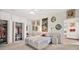 Bright bedroom boasts a large bed, closet, and decorative art at 1924 Seclusion Dr, Port Orange, FL 32128