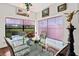 Bright and airy dining room with large windows and views of the lush landscape at 1924 Seclusion Dr, Port Orange, FL 32128