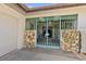 A gated entrance featuring stone columns and an ornate metal gate providing security and architectural detail at 1924 Seclusion Dr, Port Orange, FL 32128