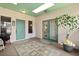 Inviting foyer features tile flooring, unique ceiling detail and dual entry points, offering a bright, welcoming space at 1924 Seclusion Dr, Port Orange, FL 32128