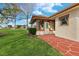 Home exterior featuring a glass enclosed porch, walkway and a well-manicured lawn at 1924 Seclusion Dr, Port Orange, FL 32128