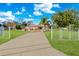 Gated property with a circular drive and mature landscaping at 1924 Seclusion Dr, Port Orange, FL 32128