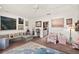 Bright, airy living room features plush carpeting, eclectic artwork, and contemporary lighting for a stylish and inviting space at 1924 Seclusion Dr, Port Orange, FL 32128