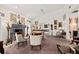 Stylish living room featuring a fireplace, plush carpeting, and an array of eclectic décor, creating a unique atmosphere at 1924 Seclusion Dr, Port Orange, FL 32128