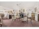 Expansive living room boasting a stone fireplace, plush carpeting, and abundant natural light, exuding comfort and style at 1924 Seclusion Dr, Port Orange, FL 32128