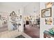 Grand living area with a fireplace, plush carpeting, and bright lighting, perfect for gatherings or quiet evenings at 1924 Seclusion Dr, Port Orange, FL 32128