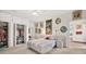 Bright main bedroom features a walk-in closet and comfortable furnishings at 1924 Seclusion Dr, Port Orange, FL 32128