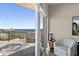 Balcony featuring a comfortable chair, scenic ocean view, and a sliding glass door at 2 Oceans West Blvd # 1905, Daytona Beach Shores, FL 32118