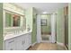 Clean, well-lit bathroom with a large vanity, tub/shower combo, and tile accents at 2 Oceans West Blvd # 1905, Daytona Beach Shores, FL 32118