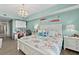 This bedroom features a dedicated work space and sliding glass doors leading to a private balcony at 2 Oceans West Blvd # 1905, Daytona Beach Shores, FL 32118