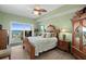 Bright bedroom with ceiling fan, wood floors, a balcony and beautiful views of the water at 2 Oceans West Blvd # 1905, Daytona Beach Shores, FL 32118
