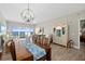 Dining room featuring a dining table with seating for six, a china cabinet and floor-to-ceiling windows with water views at 2 Oceans West Blvd # 1905, Daytona Beach Shores, FL 32118
