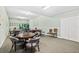 Community game room with multiple tables and chairs, perfect for leisure activities and social gatherings at 2 Oceans West Blvd # 1905, Daytona Beach Shores, FL 32118
