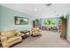 A game room featuring lounge chairs, bookshelves, and a window providing natural light at 2 Oceans West Blvd # 1905, Daytona Beach Shores, FL 32118