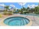 Relax in this resort-style hot tub, part of the community swimming pool, and surrounded by landscaping at 2 Oceans West Blvd # 1905, Daytona Beach Shores, FL 32118
