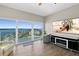 Bright living room with floor to ceiling windows and tile floors offers breathtaking water views at 2 Oceans West Blvd # 1905, Daytona Beach Shores, FL 32118