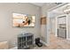 Cozy living room featuring a large-screen TV, decorative fish, and robot vacuum for modern convenience at 2 Oceans West Blvd # 1905, Daytona Beach Shores, FL 32118