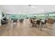 Large meeting room with ample seating, tables, and plenty of natural lighting at 2 Oceans West Blvd # 1905, Daytona Beach Shores, FL 32118