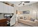 Cozy home office with built-in storage, comfortable seating, and nautical decor at 2 Oceans West Blvd # 1905, Daytona Beach Shores, FL 32118