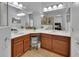 Bathroom boasts a double vanity, tiled floors, ample lighting, and a view into the shower at 205 Victoria Trails Blvd, Deland, FL 32724