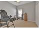 Bedroom features a window, carpeted floors and personal fitness equipment at 205 Victoria Trails Blvd, Deland, FL 32724