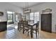 Bright dining room with sliding door access to the screened patio and backyard at 205 Victoria Trails Blvd, Deland, FL 32724