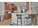 Kitchen with bar seating area features stainless steel appliances, and ample counter space at 205 Victoria Trails Blvd, Deland, FL 32724