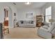 Cozy living room with plush carpeting and an entertainment cabinet at 205 Victoria Trails Blvd, Deland, FL 32724