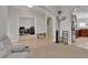 Open-concept living room with an archway to the kitchen and stainless steel appliances at 205 Victoria Trails Blvd, Deland, FL 32724
