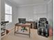 Bright home office features plantation shutters and neutral carpet at 205 Victoria Trails Blvd, Deland, FL 32724