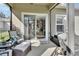 Covered patio featuring an outdoor seating area and a grill, perfect for entertaining at 205 Victoria Trails Blvd, Deland, FL 32724