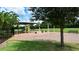 Gathering-friendly playground with swings, slides, and climbing structure shaded by a canopy in a community setting at 205 Victoria Trails Blvd, Deland, FL 32724