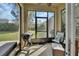 Screened in porch with room to grill, outdoor seating, and a view of the landscaped backyard at 205 Victoria Trails Blvd, Deland, FL 32724