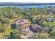 Aerial view of the estate featuring a fountain, multiple buildings, pool and expansive landscaping at 2111 Hontoon Rd, Deland, FL 32720