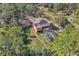 Home from above with a swimming pool, large yard and surrounded by mature trees at 2111 Hontoon Rd, Deland, FL 32720