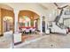 Elegant dining room with tile floors, beautiful columns, and easy access to the kitchen and staircase at 2111 Hontoon Rd, Deland, FL 32720