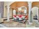 Cozy dining area with decorative columns, modern chandelier, and seamless flow into the spacious kitchen at 2111 Hontoon Rd, Deland, FL 32720