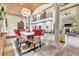 Elegant dining room with soaring ceilings, columns, and decorative chandelier and Christmas decor at 2111 Hontoon Rd, Deland, FL 32720