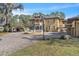 Stately home featuring a circular driveway, fountain and mature trees at 2111 Hontoon Rd, Deland, FL 32720