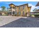 View of the house with a long driveway, and a covered walkway to a detached garage at 2111 Hontoon Rd, Deland, FL 32720