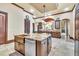 Gourmet kitchen featuring a large island, custom cabinets, stone counters, and stainless steel appliances at 2111 Hontoon Rd, Deland, FL 32720