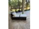 Outdoor seating area with a comfortable armchair and ottoman at 2111 Hontoon Rd, Deland, FL 32720
